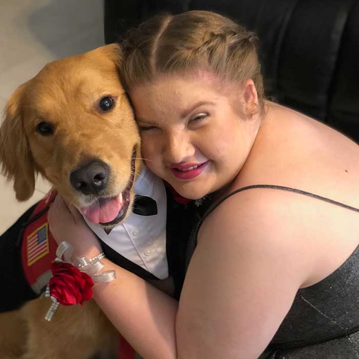 Gabriella and her Golden PAWS Service Dog Bobbi ready for prom