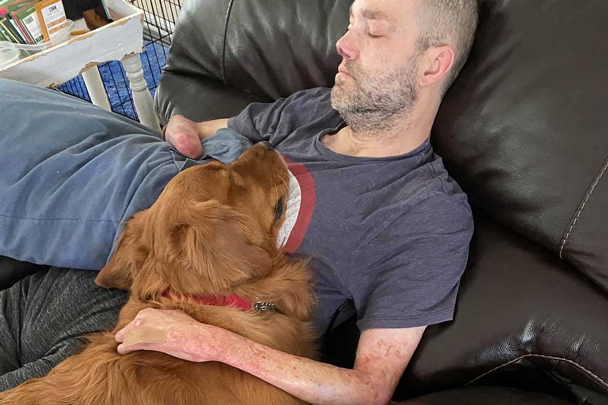 U.S. Army veteran, Chris with Golden PAWS Assistance Dog, Teddy