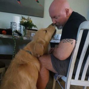 US Marine Veteran Christian with Joey D Golden PAWS Service Dog